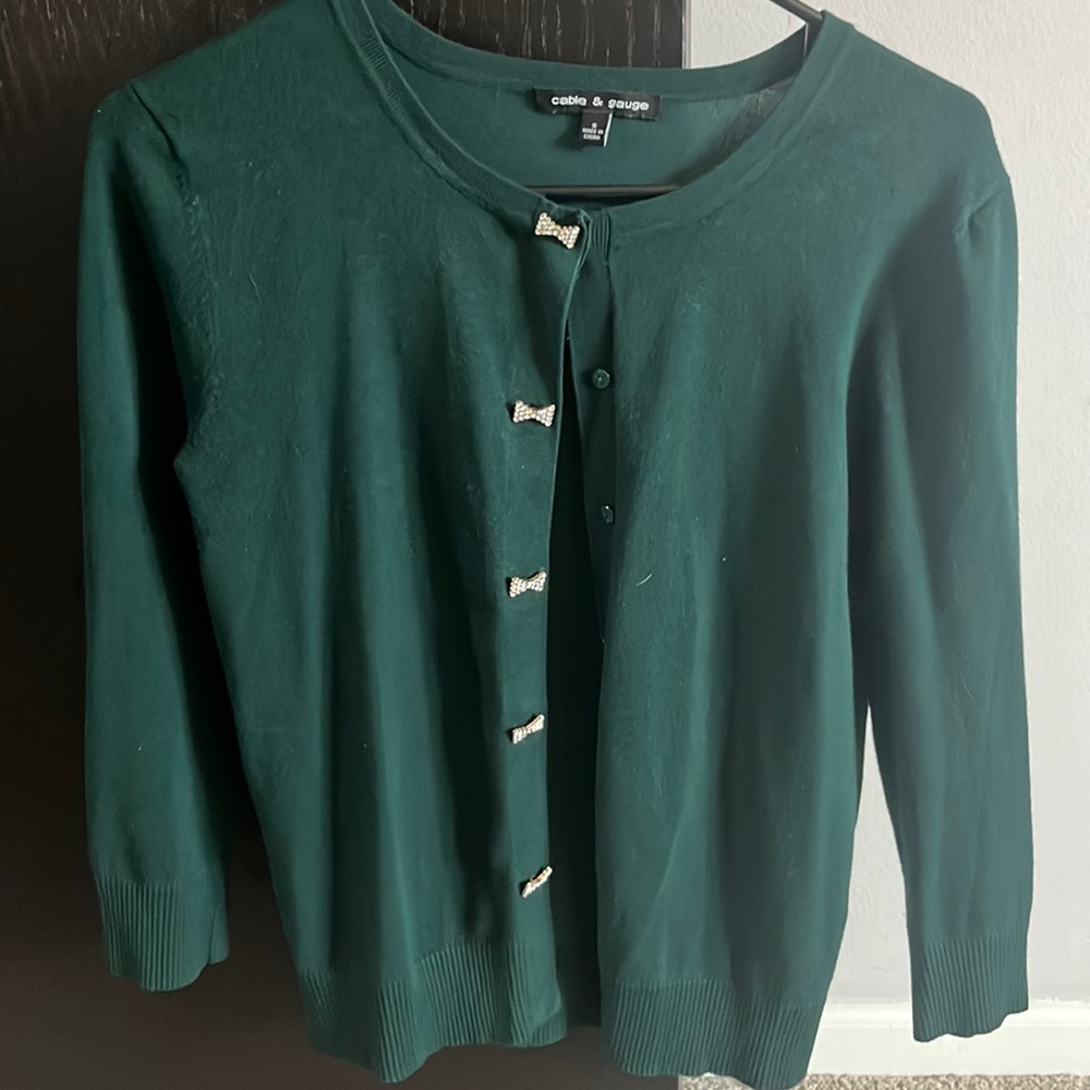 Dark green Cable & Gaige cardigan with bow buttons
